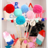 Red white and blue pom pom drink stirrers and cake toppers