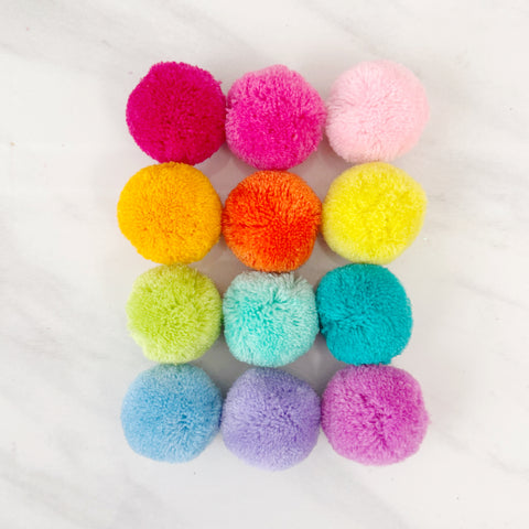 Rainbow set of pom poms